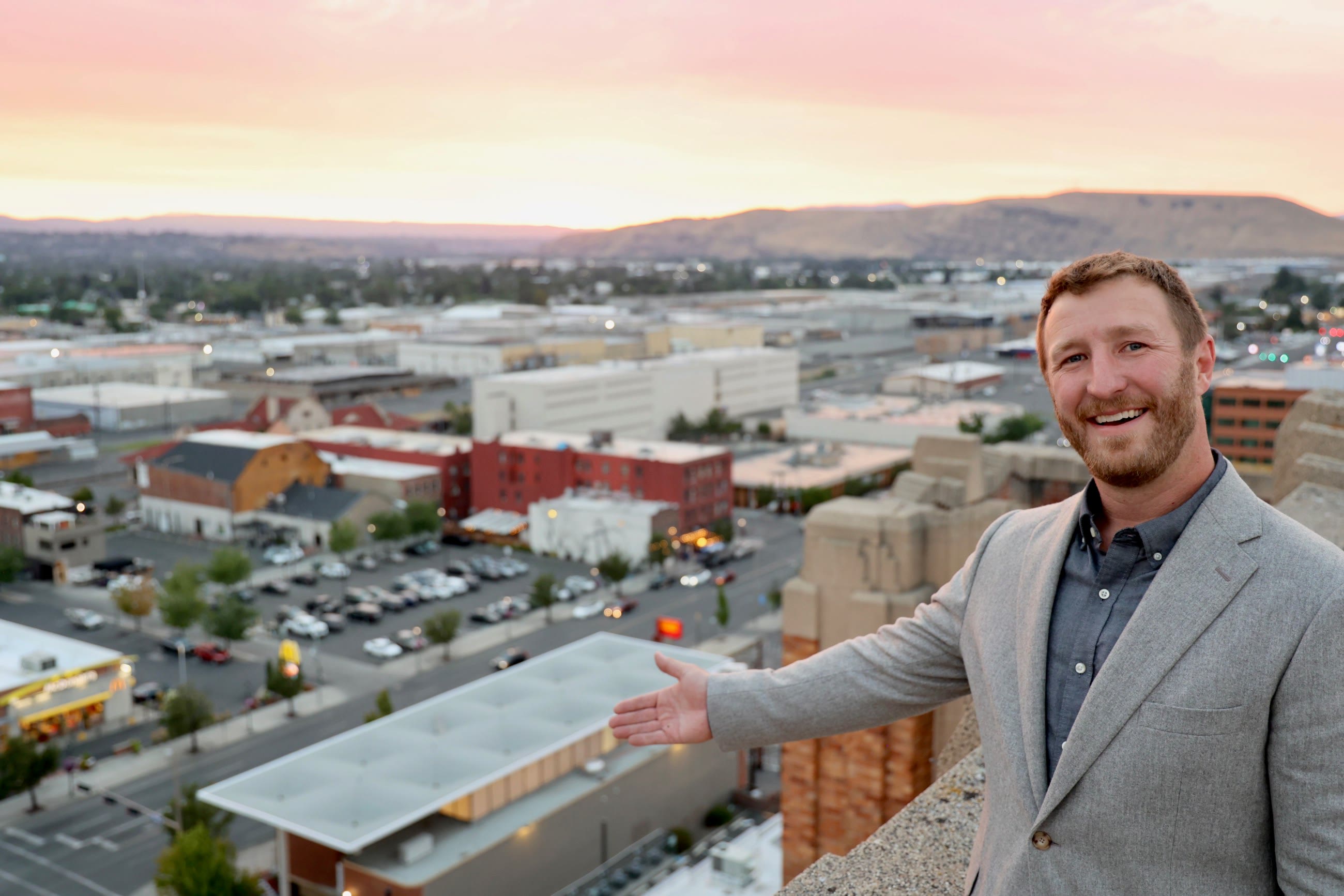 Jacob James, owner of JOIST, on a rooftop overlooking downtown Yakima